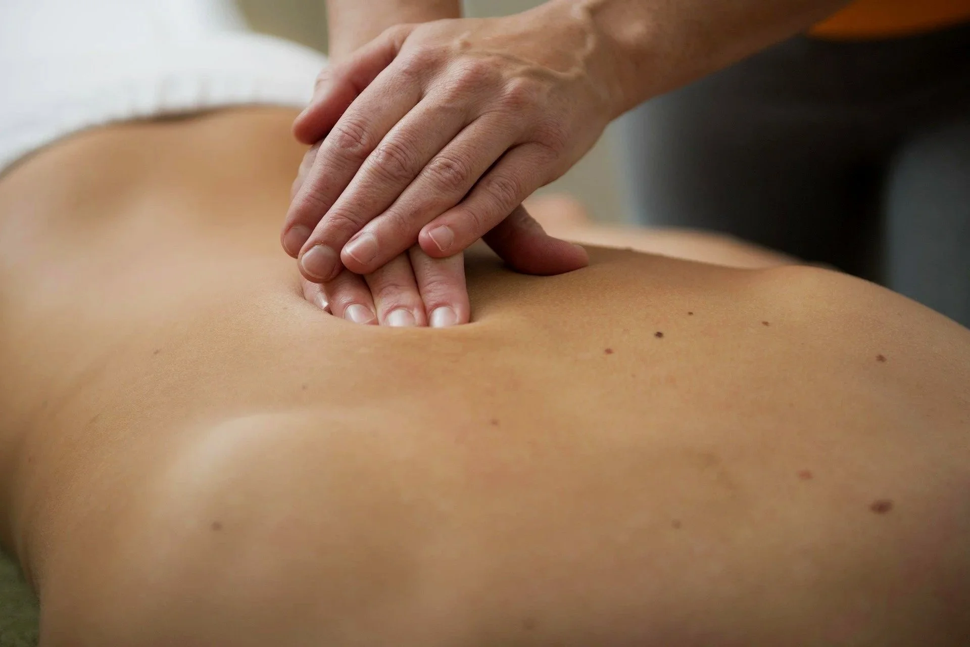 A person receiving a back massage.