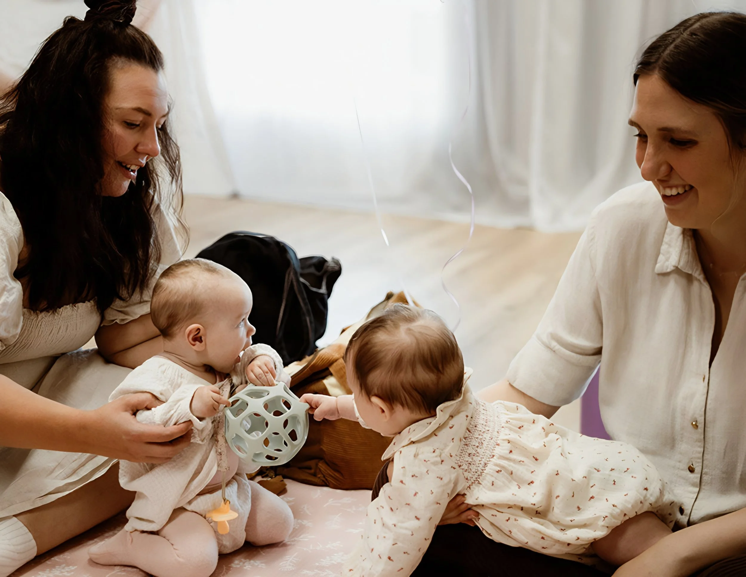 Playgroup mums and dads playing with their children who are playing with toys