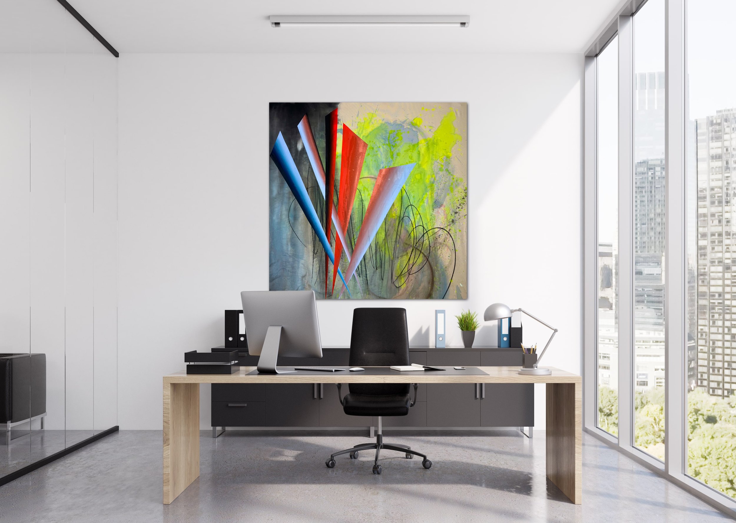 Modern office with a large desk, black chair, and computer, positioned in front of a colorful abstract painting on the white wall. Bright natural light from tall windows shows city buildings outside.