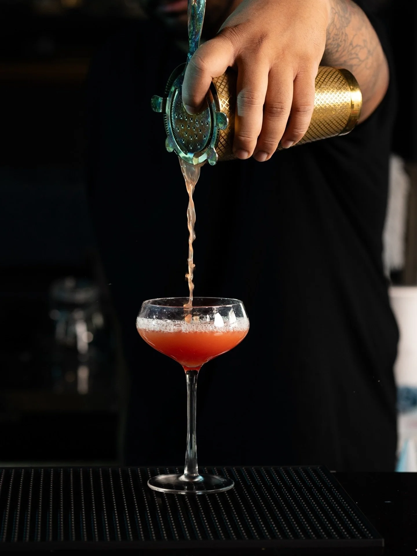 The weekend begins in the details.

A chilled coupe waiting patiently.
A slow, deliberate pour, blush-toned and silk-smooth.
The soft foam settling like it belongs there.

At Society, even the cocktail has a presence.
Measured. Refined. Unhurried.

O