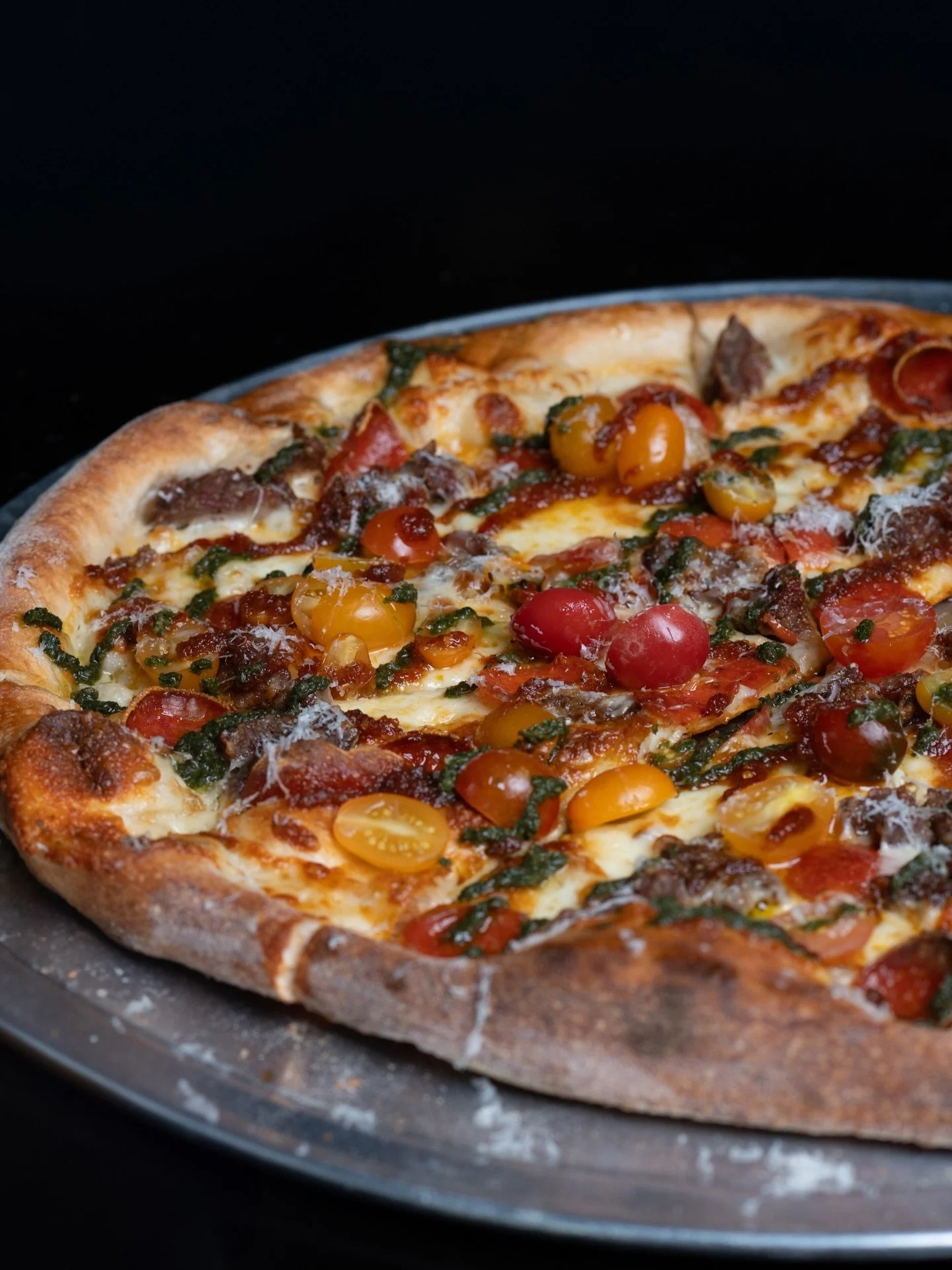 Golden crust. Bright heirloom tomatoes. Fresh greens finished with a snowfall of parmesan.

At Society Pizza Lounge, every detail is layered with purpose from hand-stretched dough to clean, vibrant ingredients and cocktails crafted to match the momen