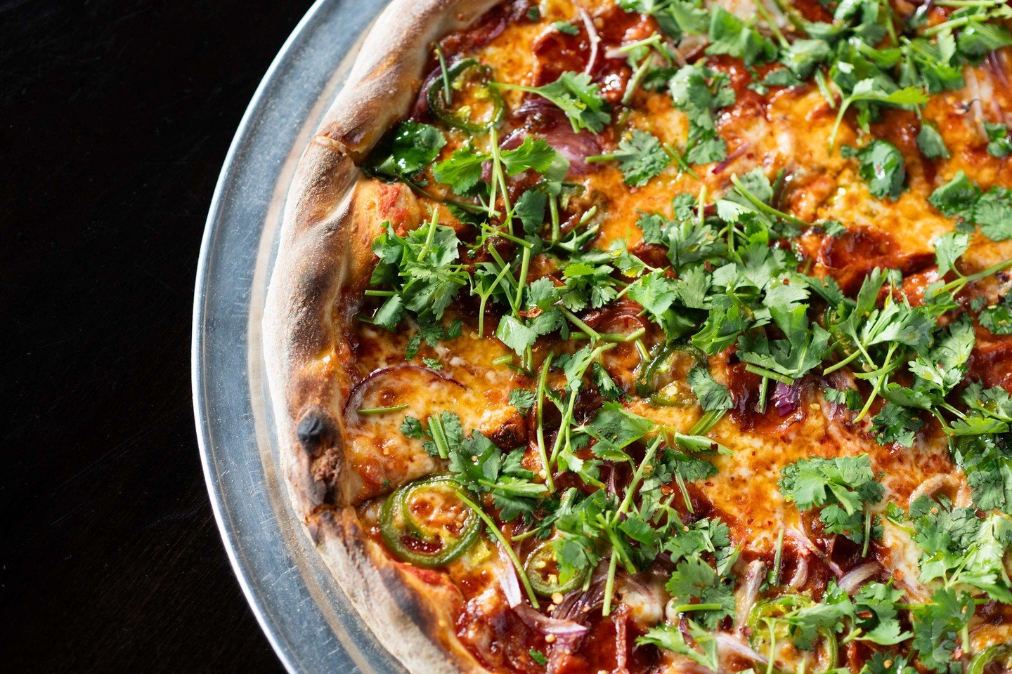 "Craft begins long before the first slice.

A 72-hour fermented dough.
Sauce layered with intention.
Heat that blisters the crust just enough.

Then the finish 
fresh herbs placed by hand, not by habit.

Every detail earns its place.

This isn&r