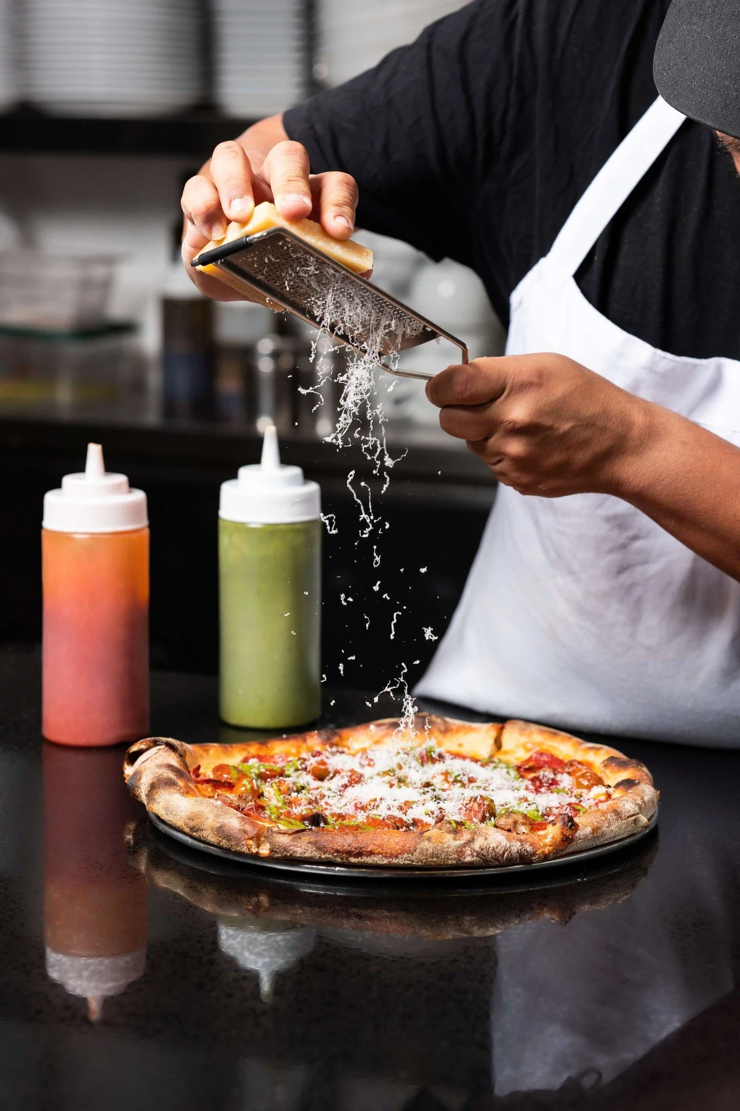 72 hours before this hits your table, the dough is already alive.
Fermenting. Building structure. Developing the kind of flavor you can't rush and can't fake.
Hand-crushed tomatoes. Fresh mozzarella pulled that day. Toppings that earn their place or 