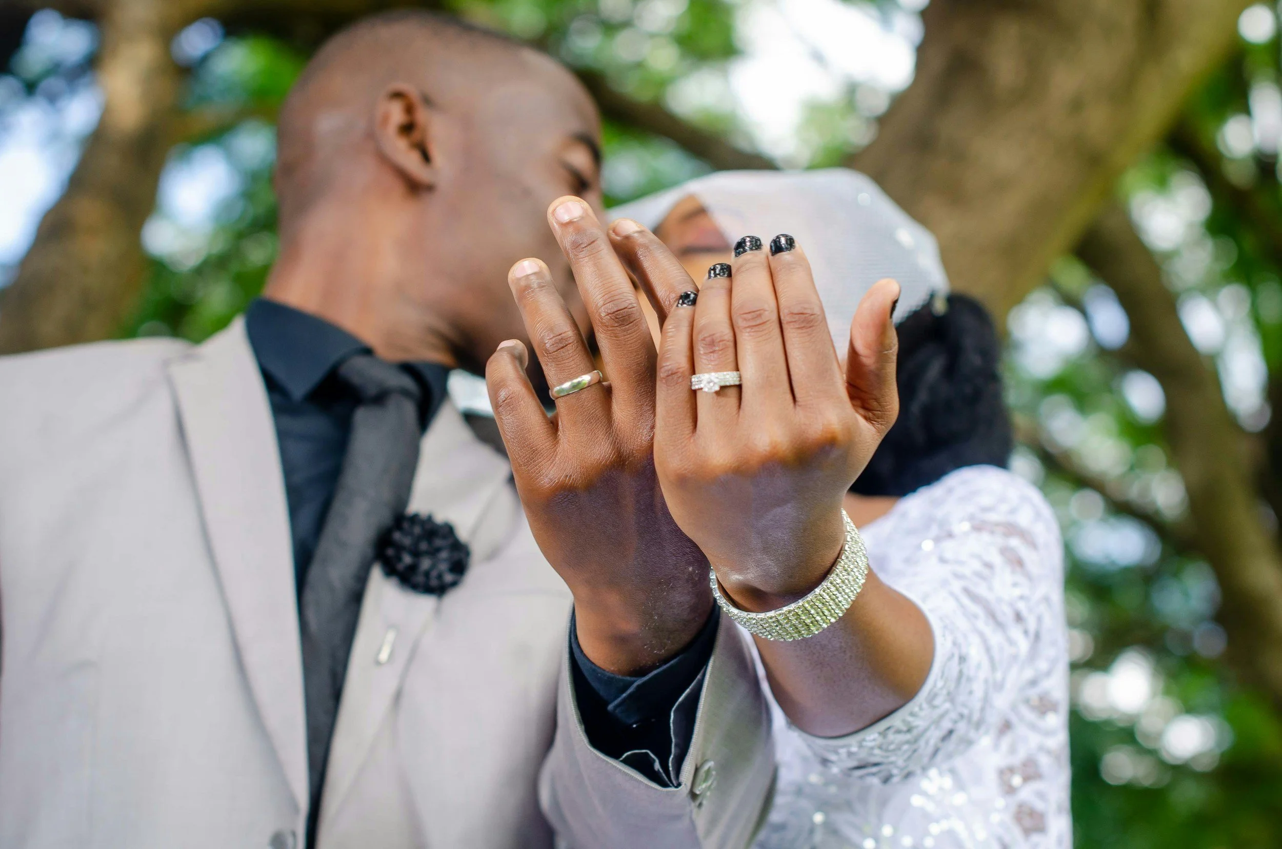 Couple just married showing their wedding rings