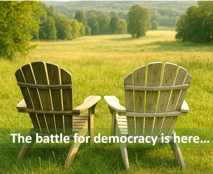 Two wooden Adirondack chairs facing a lush green field with trees in the background, with overlay text reading 'The battle for democracy is here...'.