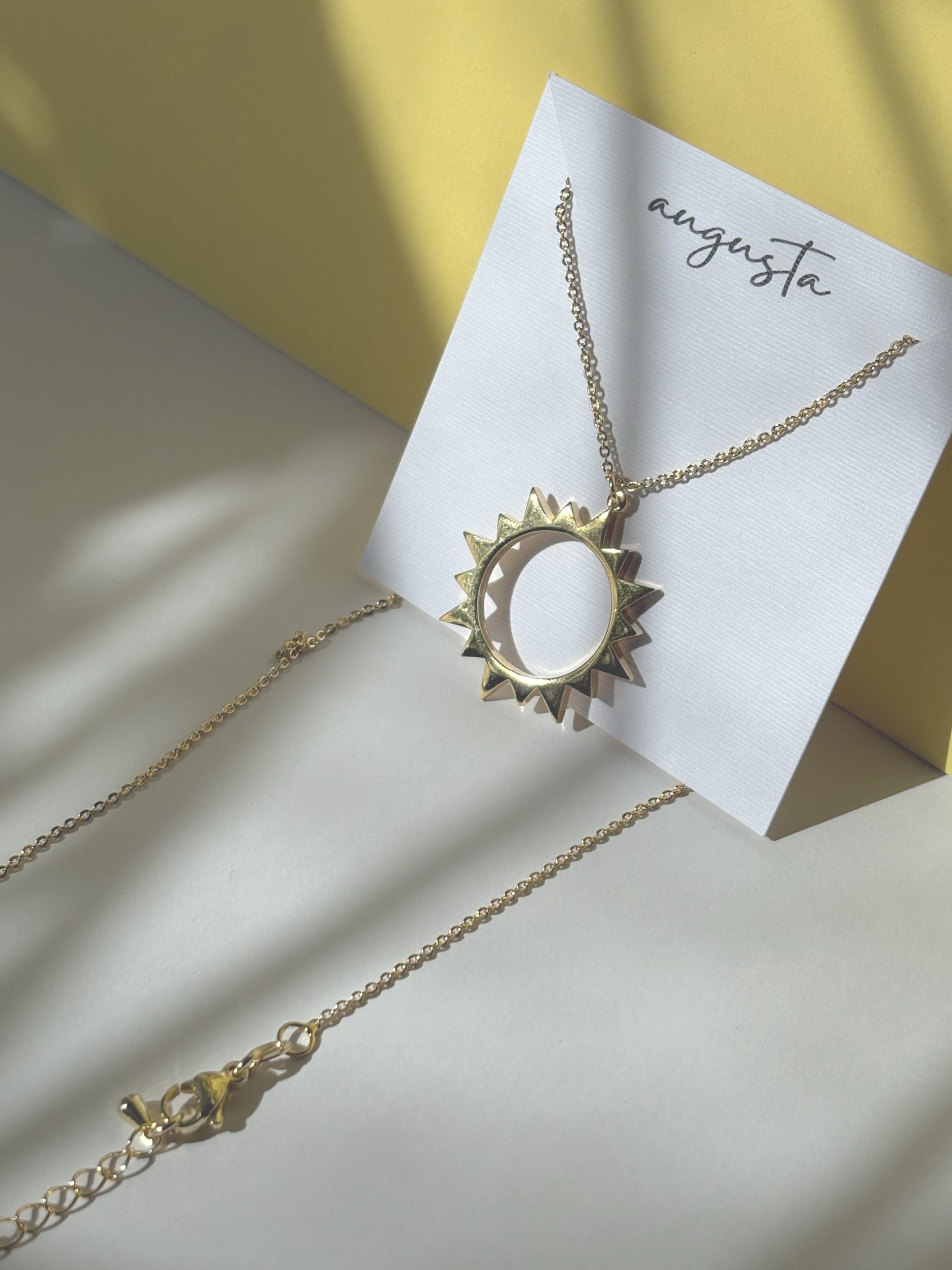 Augusta Jewellery Sun Charm Pendant in shadow