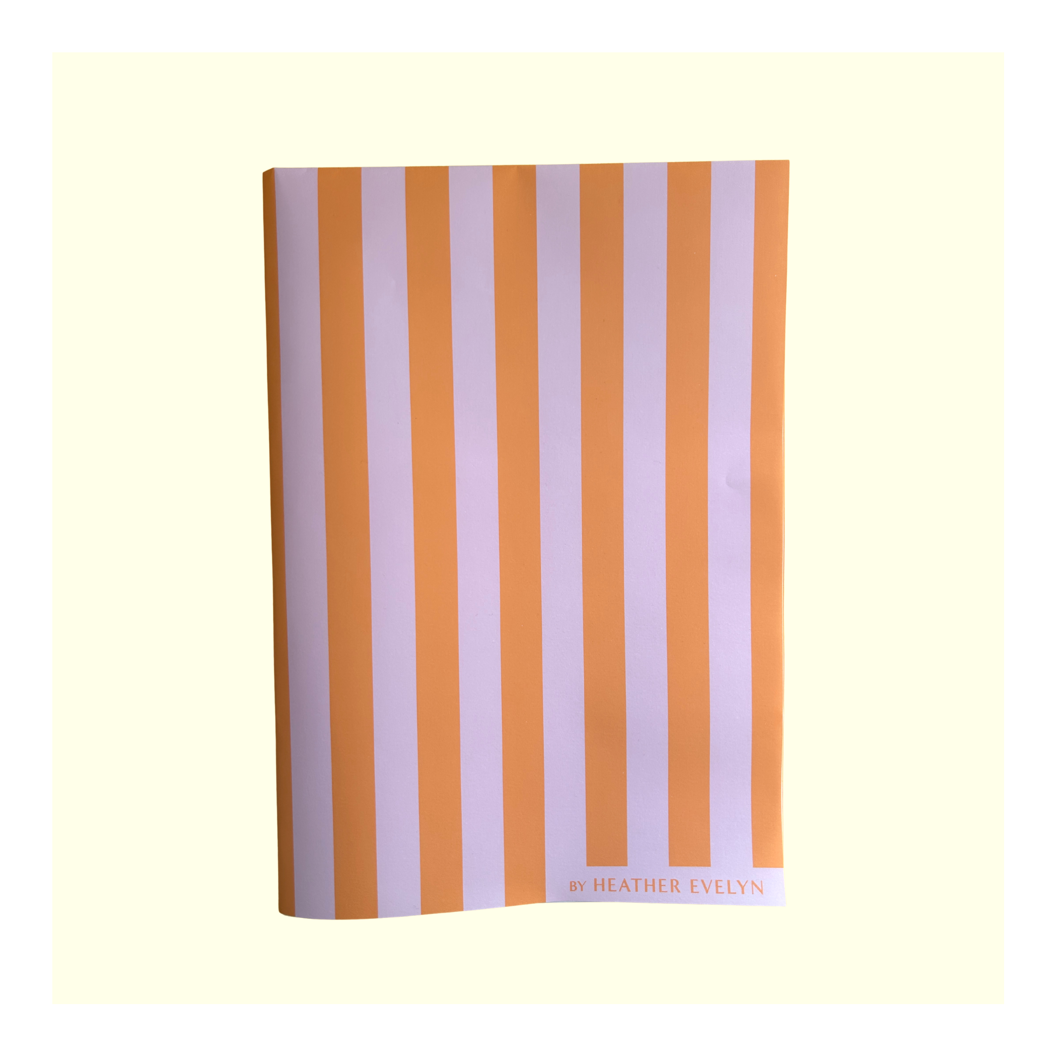 Heather Evelyn Orange and Pink Striped Gift Wrap folded