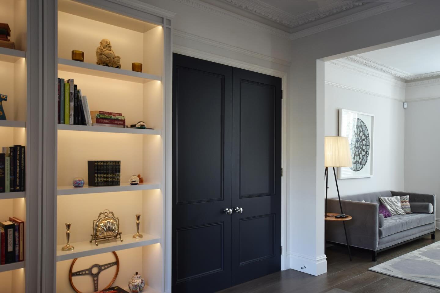 Simple changes can make a big impact - in this project we refurbished the ground floor drawing room by fitting gorgeous new timber flooring from @trunkfloor , a fireplace and adding oversized double doors and a fitted shelving unit. The black paint t