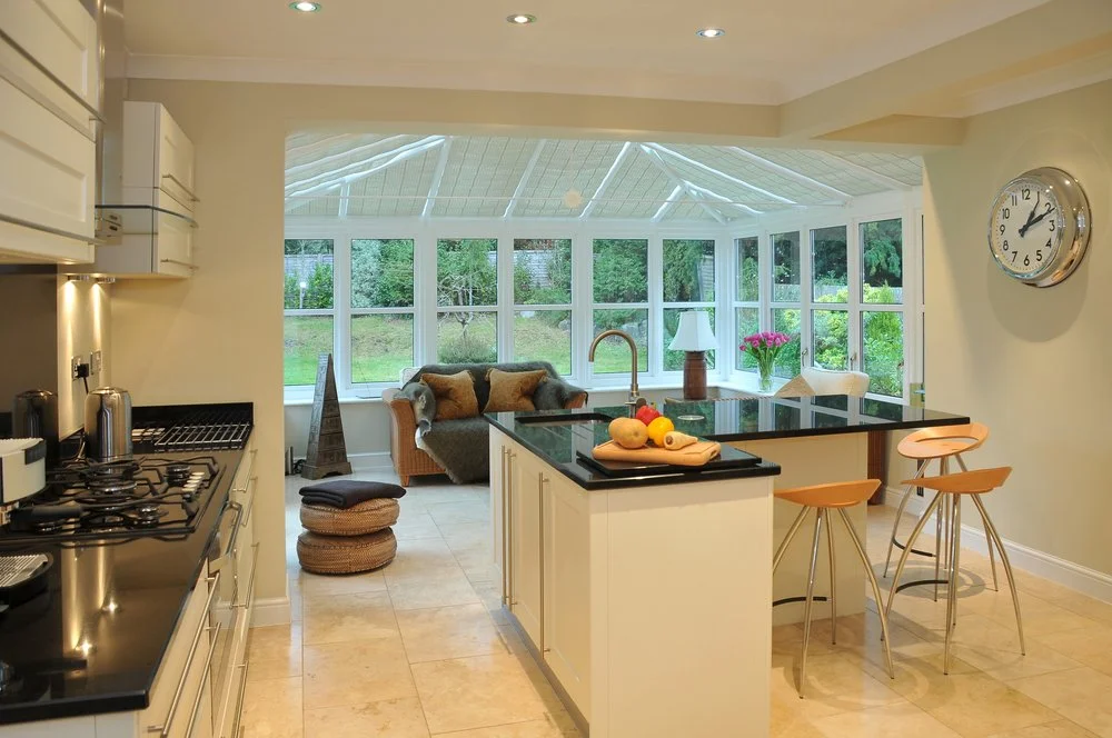 Single-storey extension with open-plan kitchen and dining area with garden views