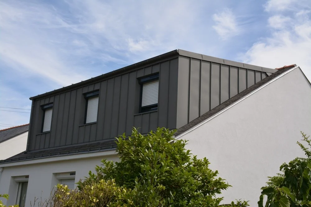 Mansard loft conversion with modern cladding and large windows