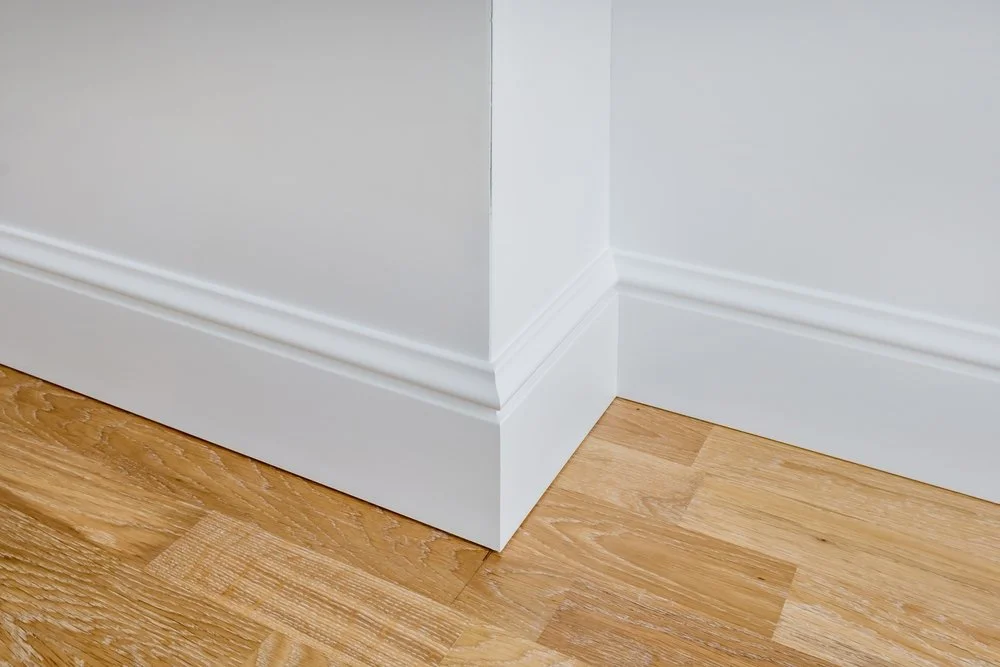 Skirting board and door frame carpentry detail with clean finish