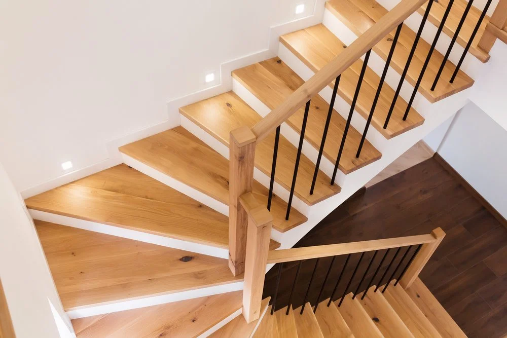 Wooden staircase installation in new build home with modern interior finish