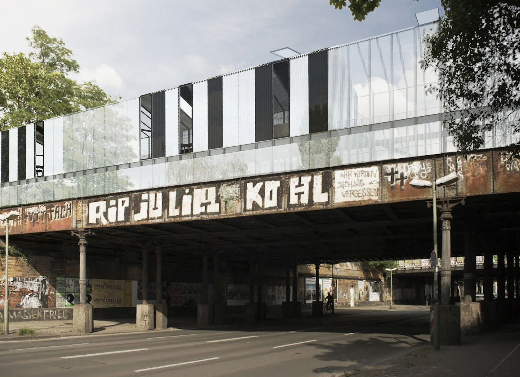 Une structure de pont avec des graffitis sur le côté, des arbres verts en arrière-plan, et une zone d'ombre en dessous.
