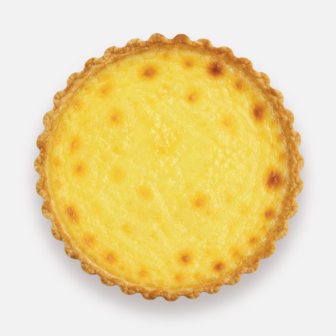 Four egg custard tarts with golden filling in flaky pastry crusts on a white surface.