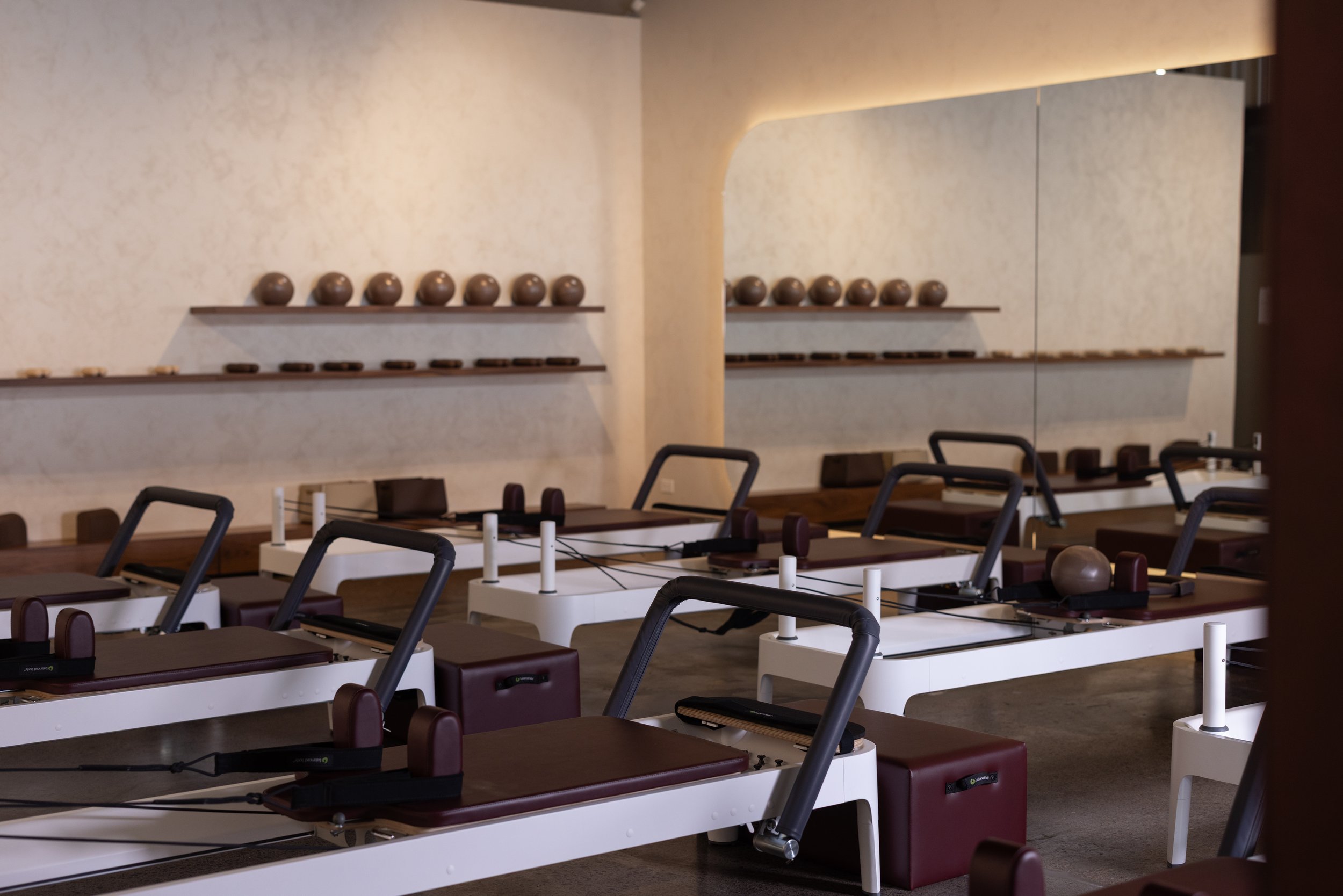 Aligne Studio reformer Pilates space in Auckland, featuring a boutique design-led interior and premium equipment