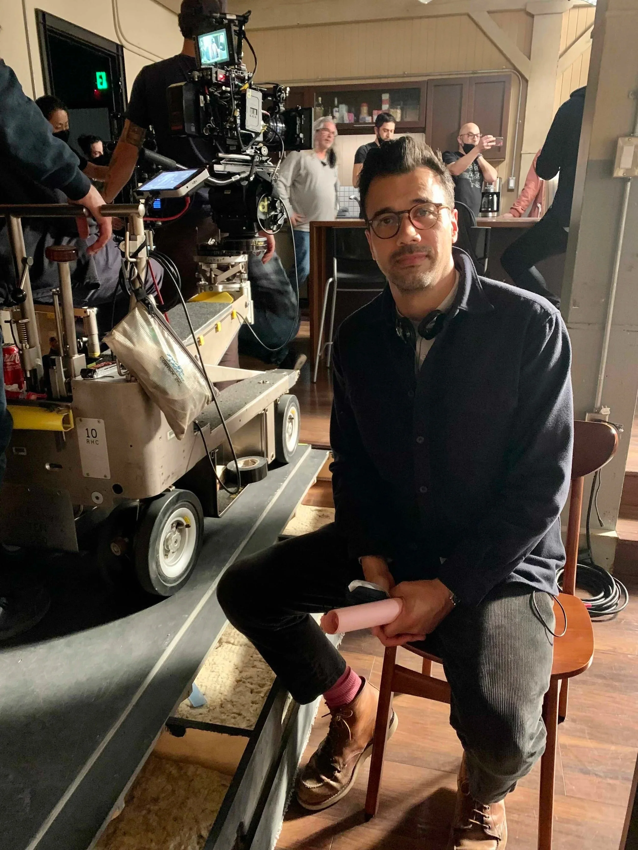 Phillip Rhys Chaudhary Sitting on set directing