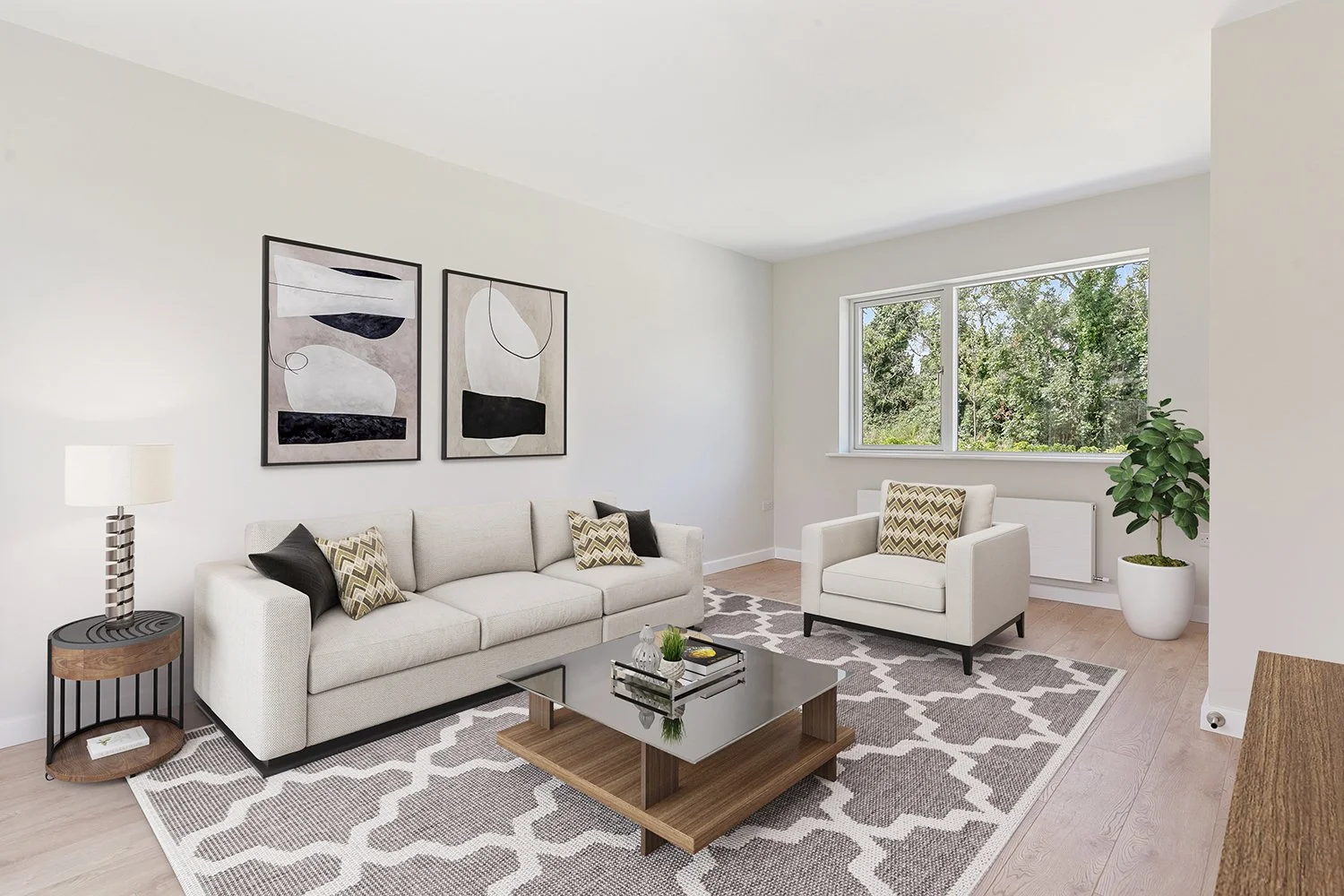 A modern, minimalistic living room with white walls, a beige sofa with patterned and black pillows, a white armchair with a patterned pillow, a wooden coffee table with a glass top, a geometric rug, abstract artwork on the wall, a side table with a l