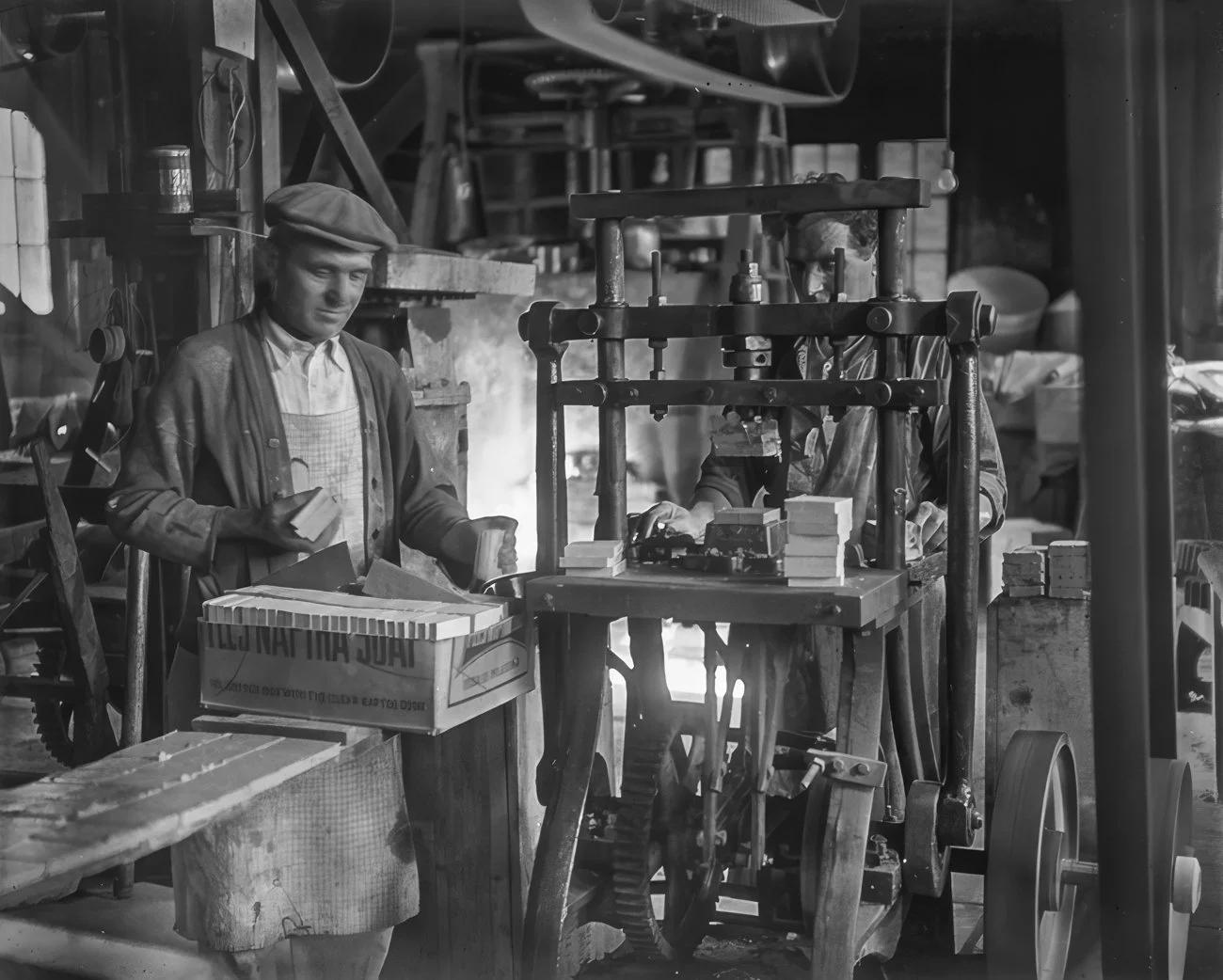Two men work with tile at Pewabic Pottery in Detroit, Michigan, date unknown. Photo from the Burton Historical Collection, Detroit Public Library. Retouching by Helmut Ziewers.
