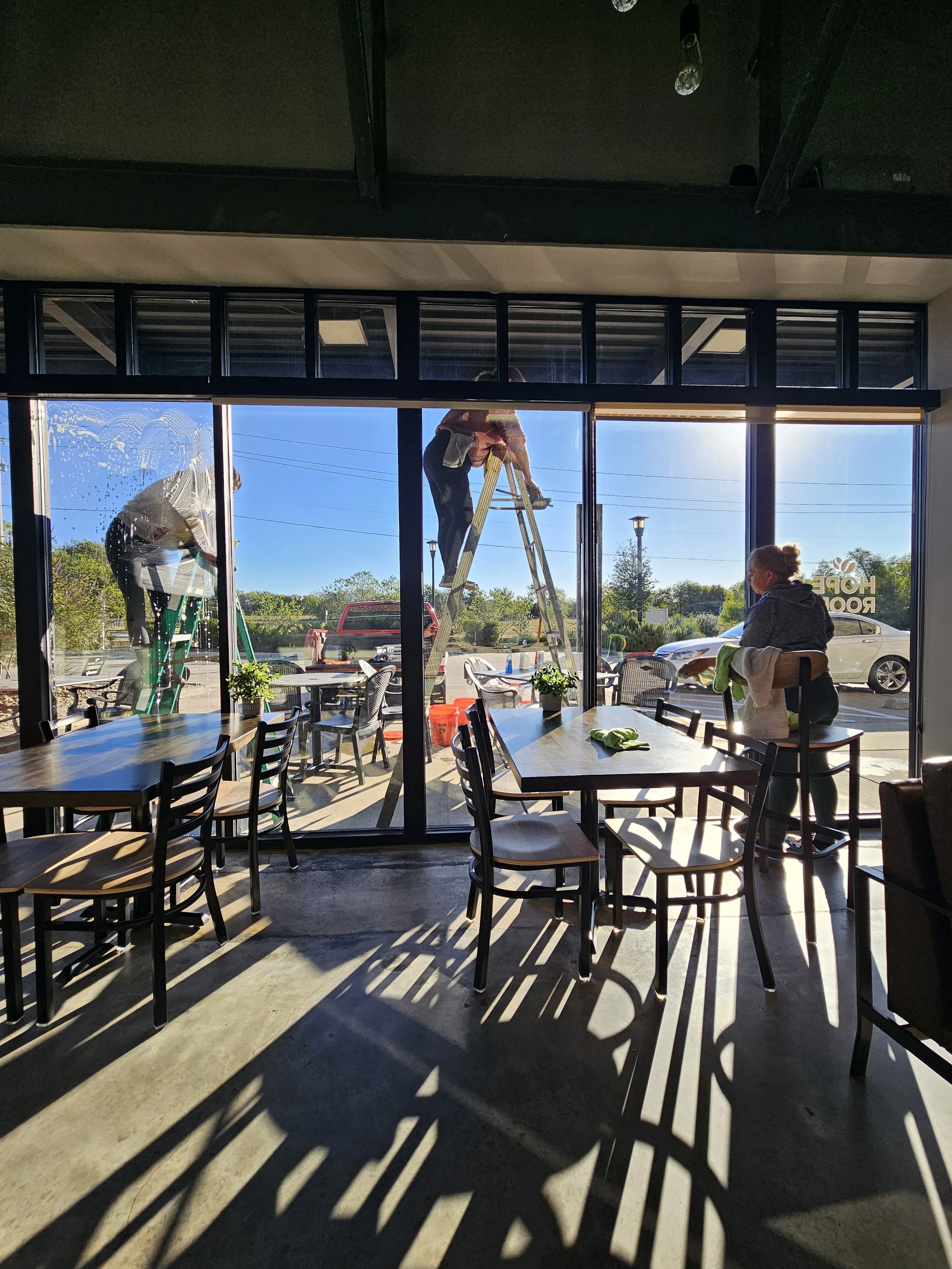 Professional janitorial crew from pristine office solutions cleaning a commercial office space in and around melissa texas