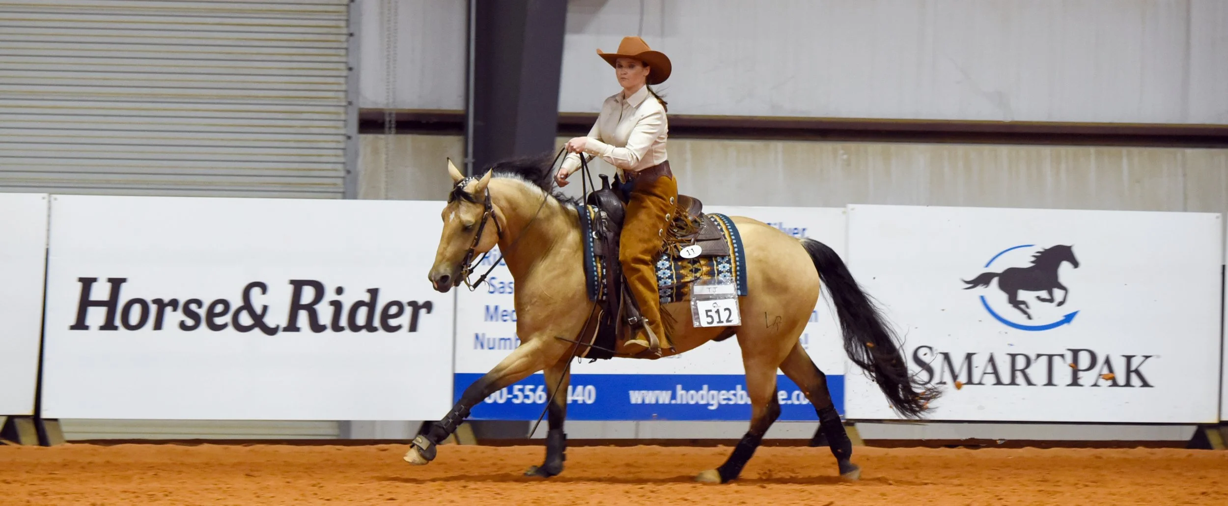 IHSA Western rider in reining class on buckskin horse