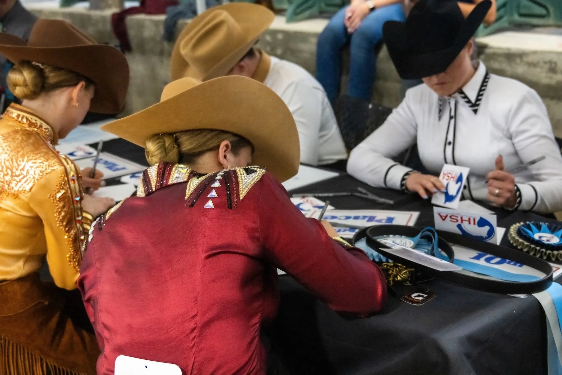 Western riders writing notes