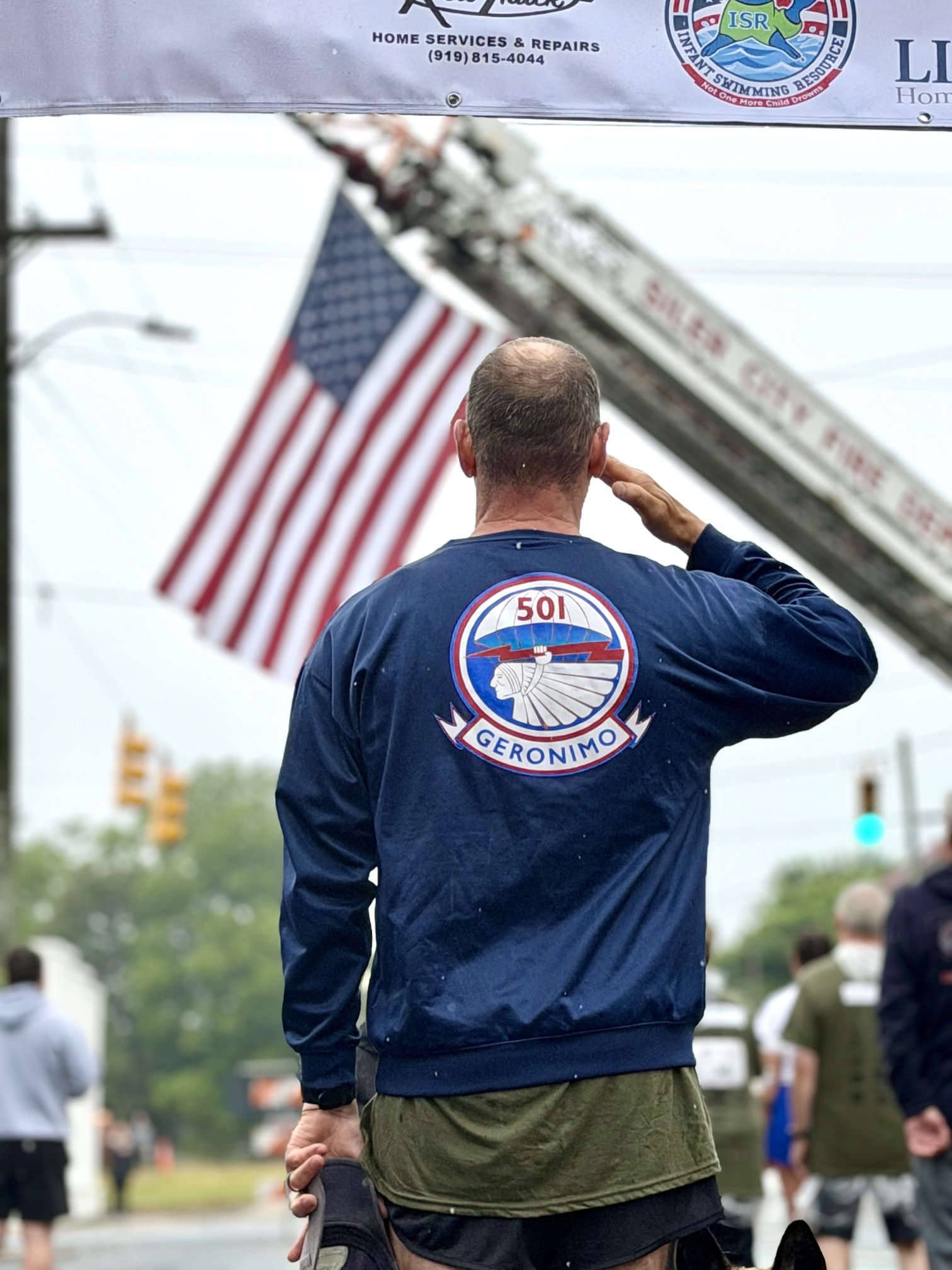 Rendering a salute during the singing of the National Anthem