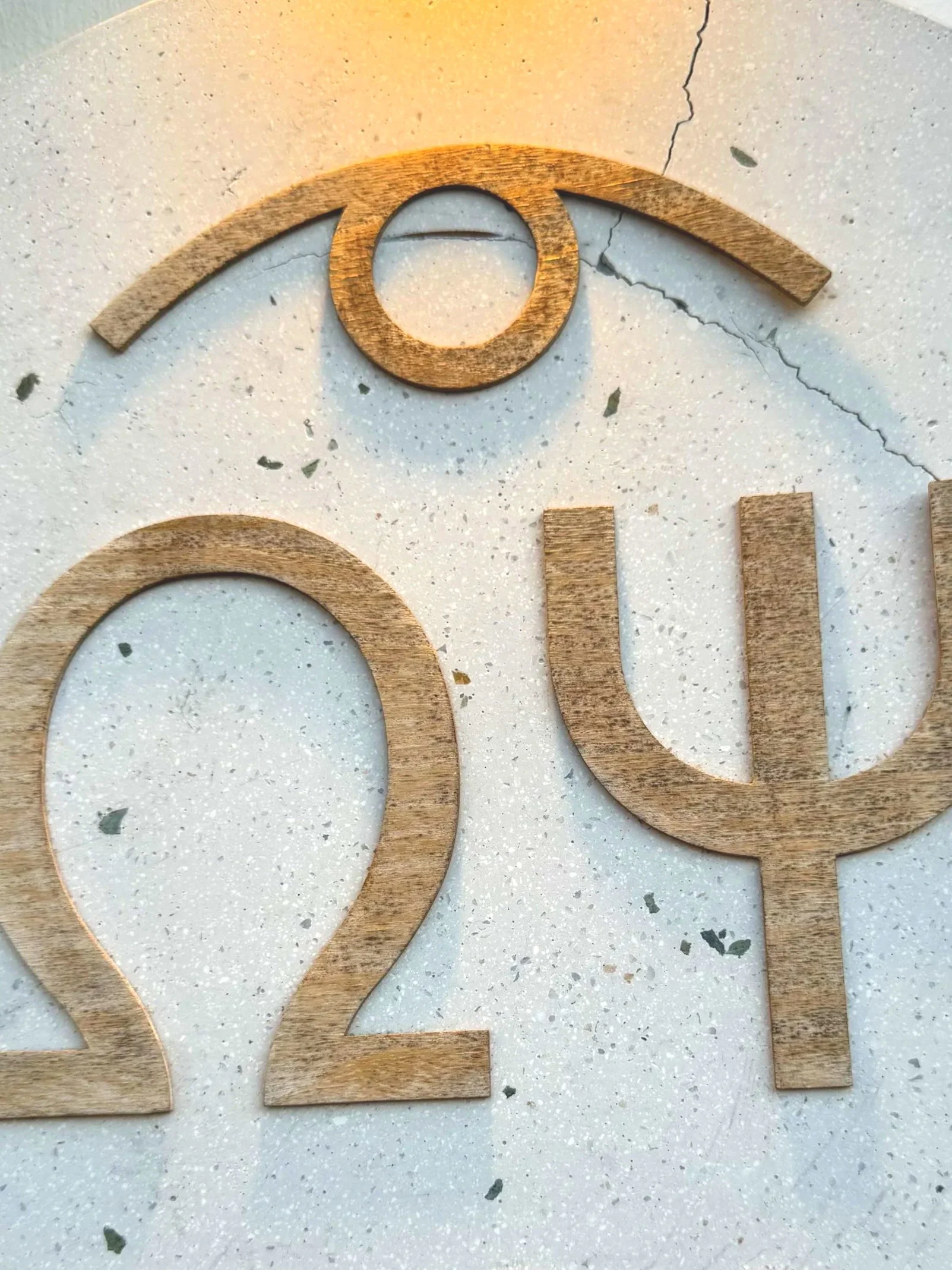 Wooden numbers 2021 on a textured light-colored surface.