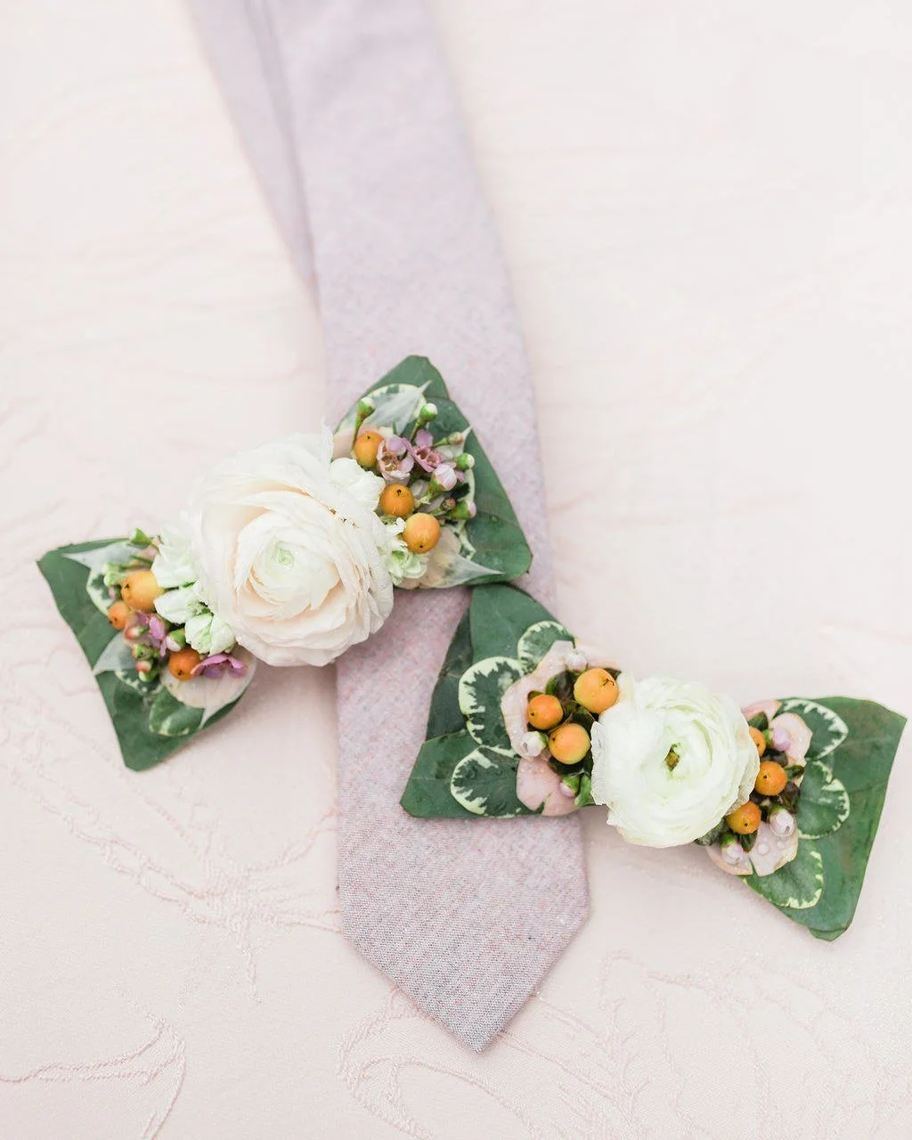 Floral bow ties for the win. We love to offer something different for our clients.