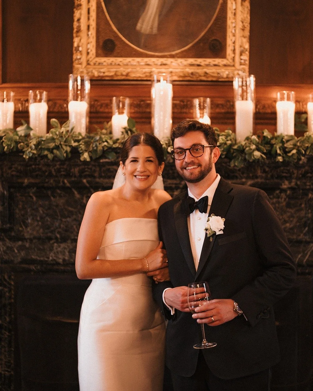 Variable height Candlelight never gets old on a mantle mixed with greenery on a mantle. 
Venue: @graylynestate