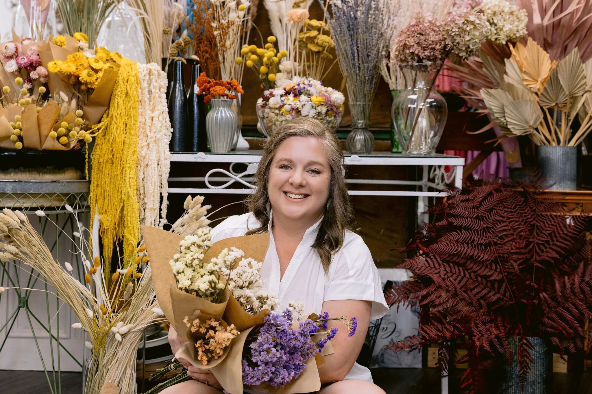 Here at the shop we love that we can add to our dried flower bar with our extra flowers from our events. We have a utility closet with lots of hooks that we can hang florals on to dry and then bring them out for a second chance in the world. We have 