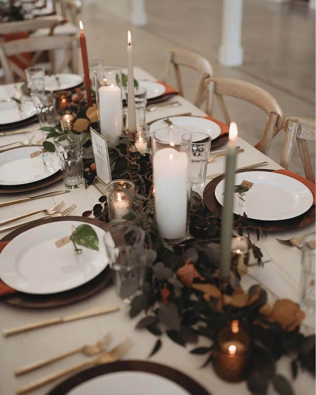 Textural table runners with varying taper candle colors is one way to add dimension to your dinner tables.