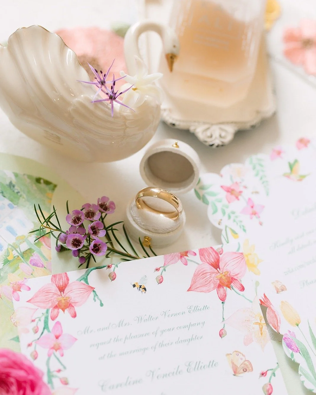 I love when the photographer pays such attention to detail to capture a shot. For me -in this photo I gasped when I saw the 2 little purple allium florets sitting on the swan next to the hyacinth bloom. And can we acknowledge how amazing the custom s