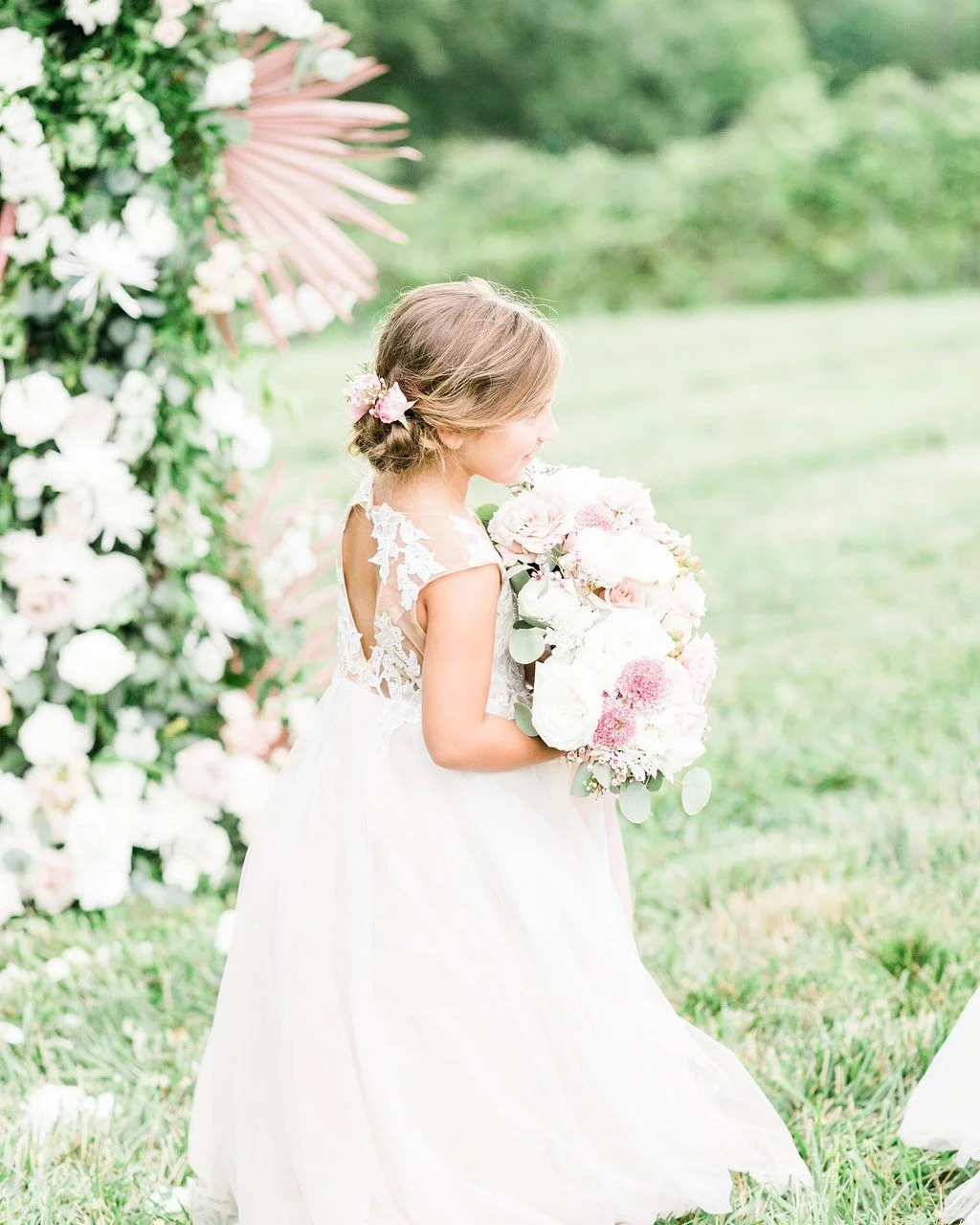 My niece holding my bouquet back in 2022 while we were taking pictures after the ceremony. One of my favorite memories to see captured in a photo. She still remembers that day vividly.