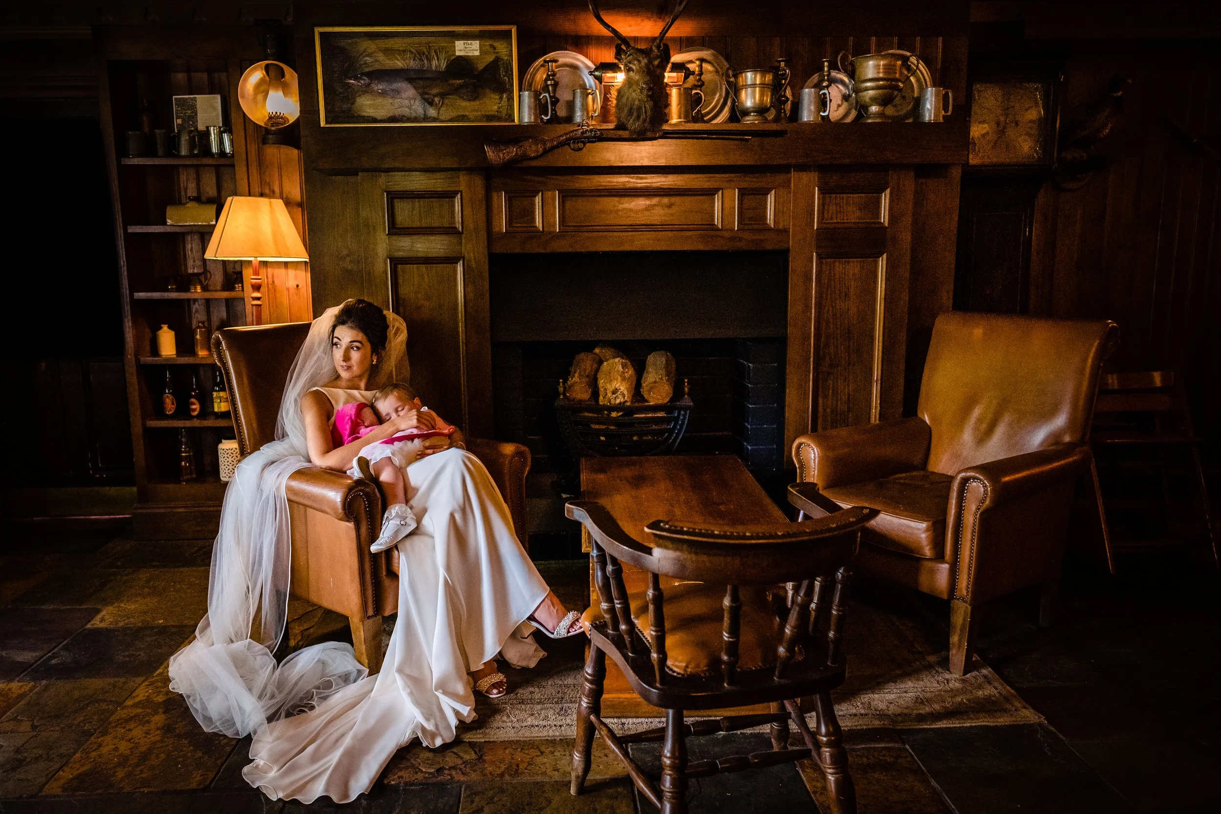 A natural image of the bride and her flower girl daughter at her wedding in BrookLodge