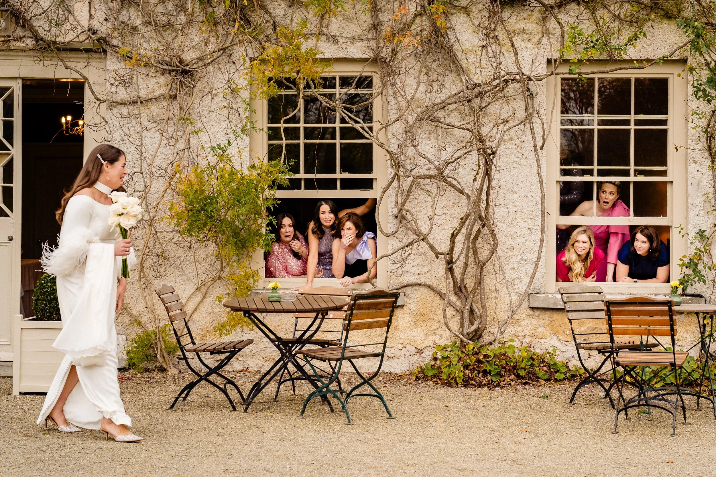 Bridesmaids react to seeing the bride for the first time at a CloughJordan House wedding