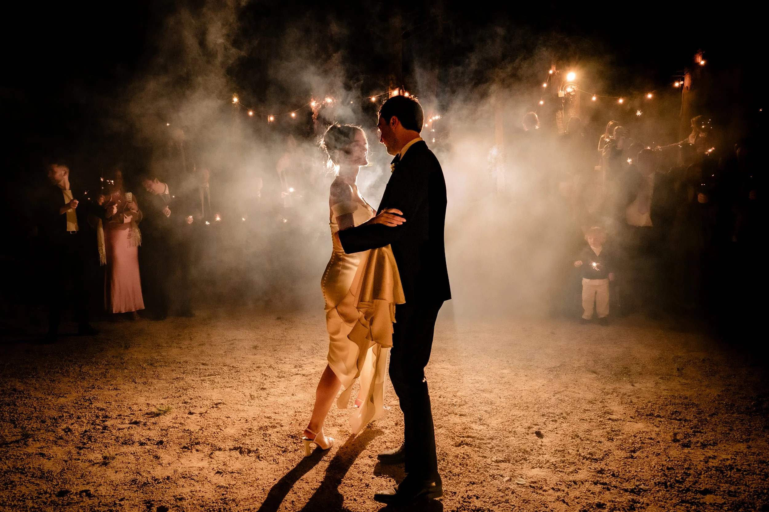Wedding photography of the outdoor first dance with sparklers at the Station House Hotel for a black tie Spring wedding