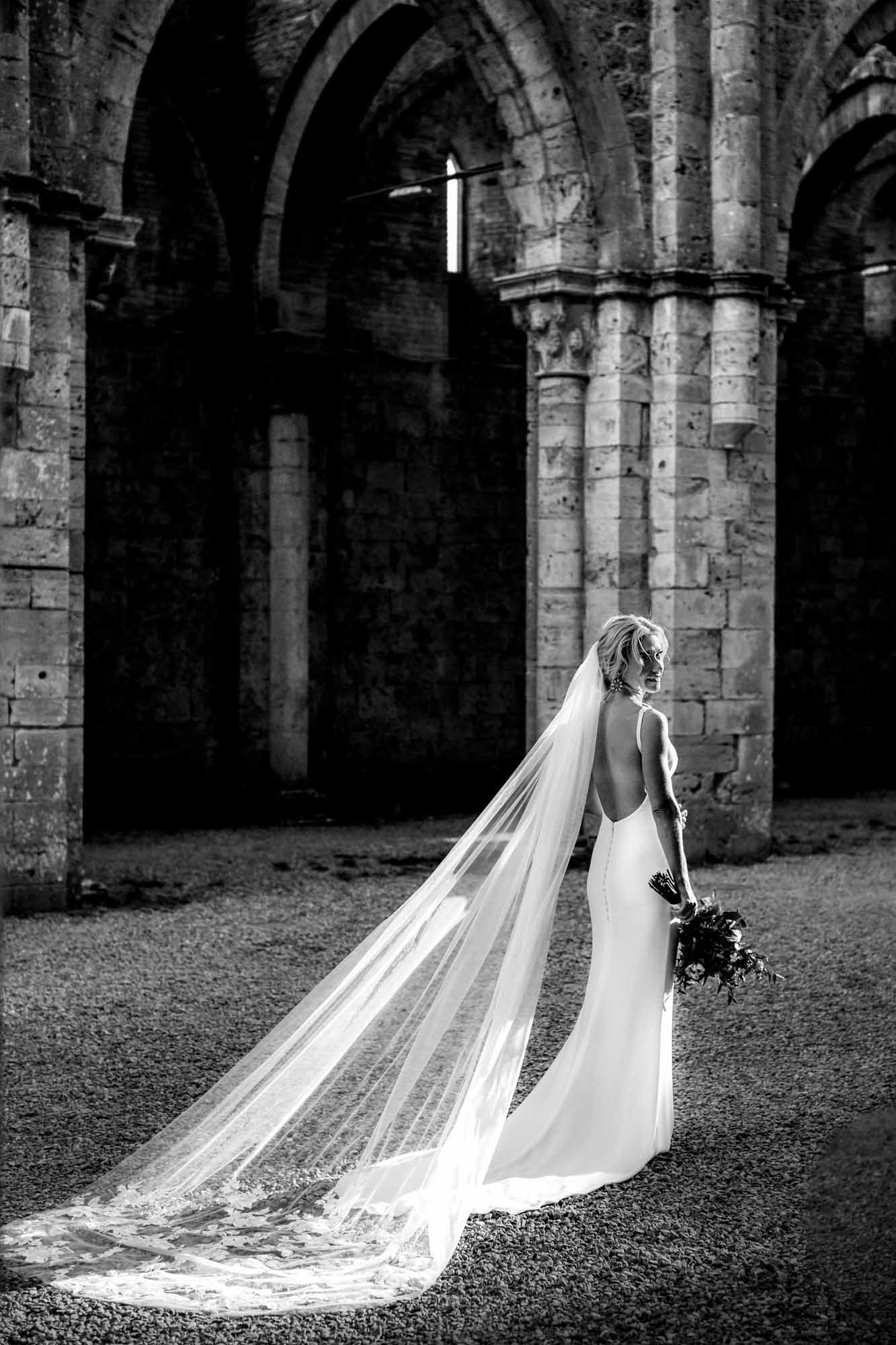A classic beautifully lit portrait of the bride in a gorgeous setting by Annie Kheffache
