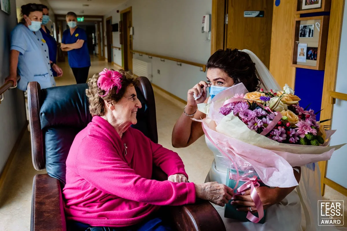 The bride visits her grandmother on her wedding day before her wedding reception in Dublin, Ireland