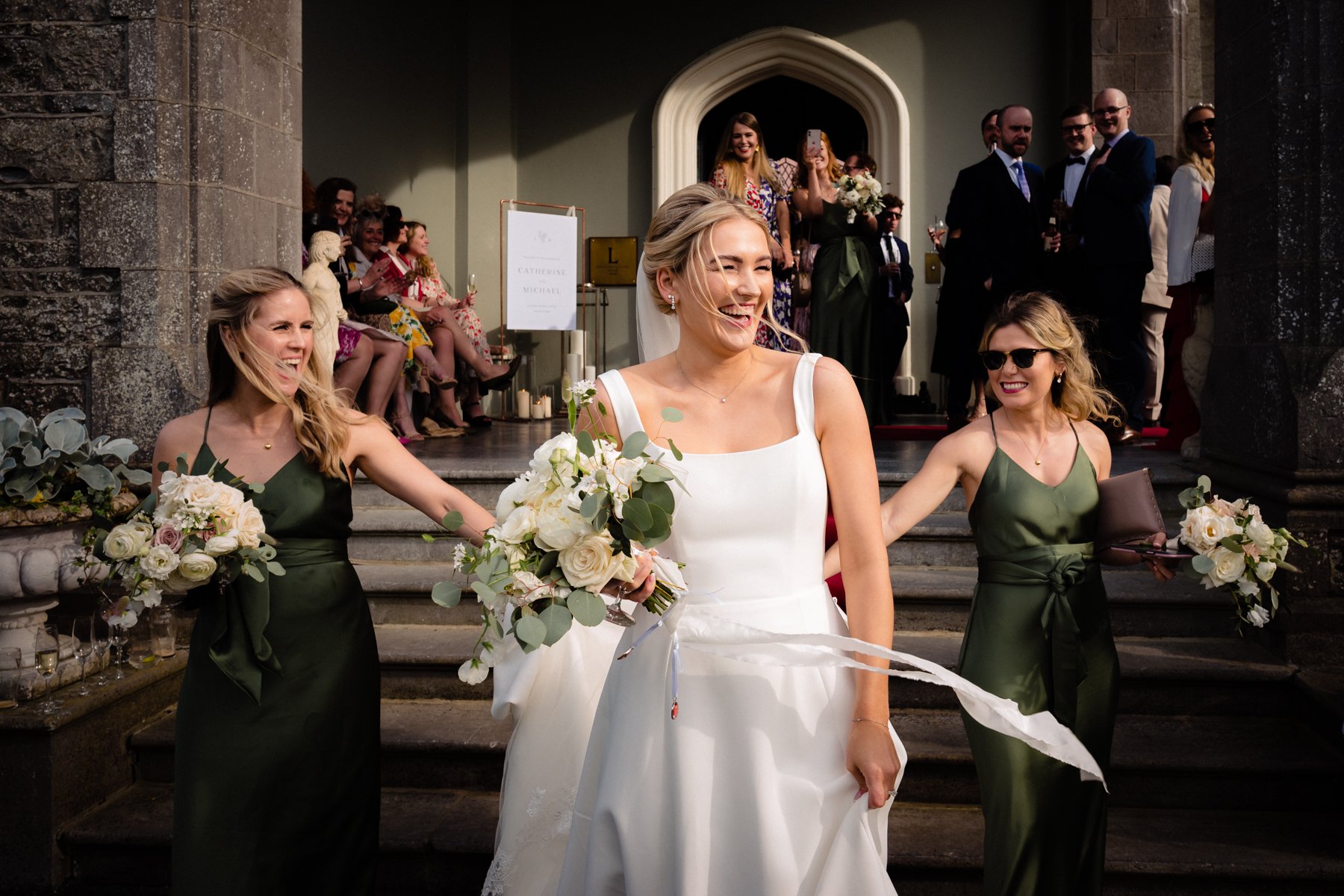 Wedding photography of the bride and bridesmaids that feels alive outside Luttrellstown Castle Dublin