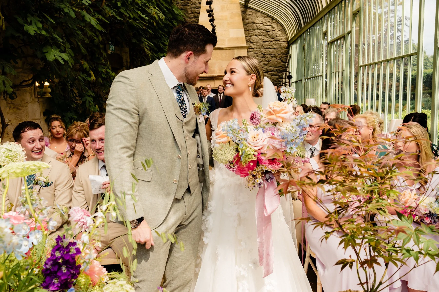 Wedding photography of a joyful moment between the bride and groom at their Cliff at Lyons wedding