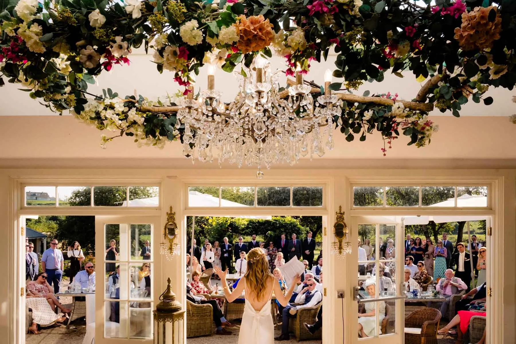Wedding photographer Annie Kheffache captures the bride giving her speech at the outdoor drinks reception at The Millhouse, Slane