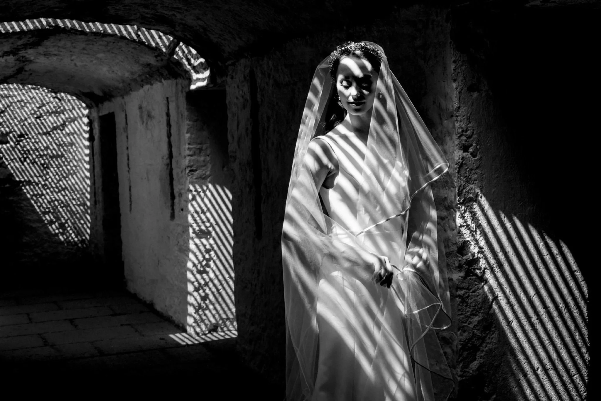 dramatic black and white image of bride in wilton castle