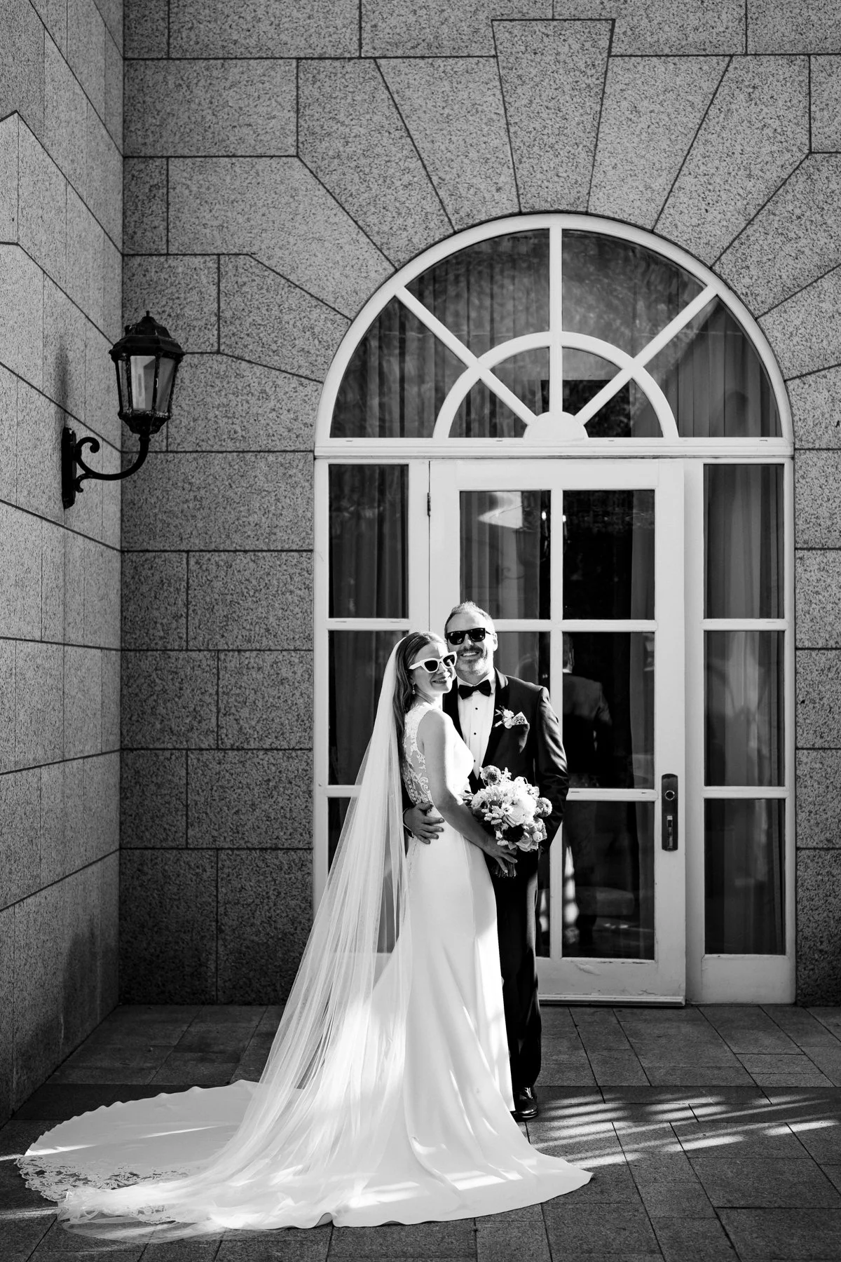Natural wedding photography of the bride and groom at their destination wedding in Dublin, Ireland held in the courtyard at the Intercontinental Hotel, Dublin