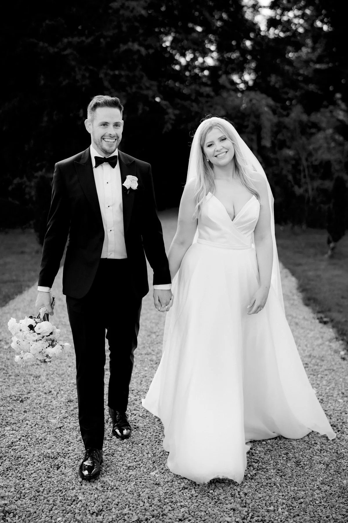 A happy couple in a classic black and white photograph from a CloughJordan House wedding