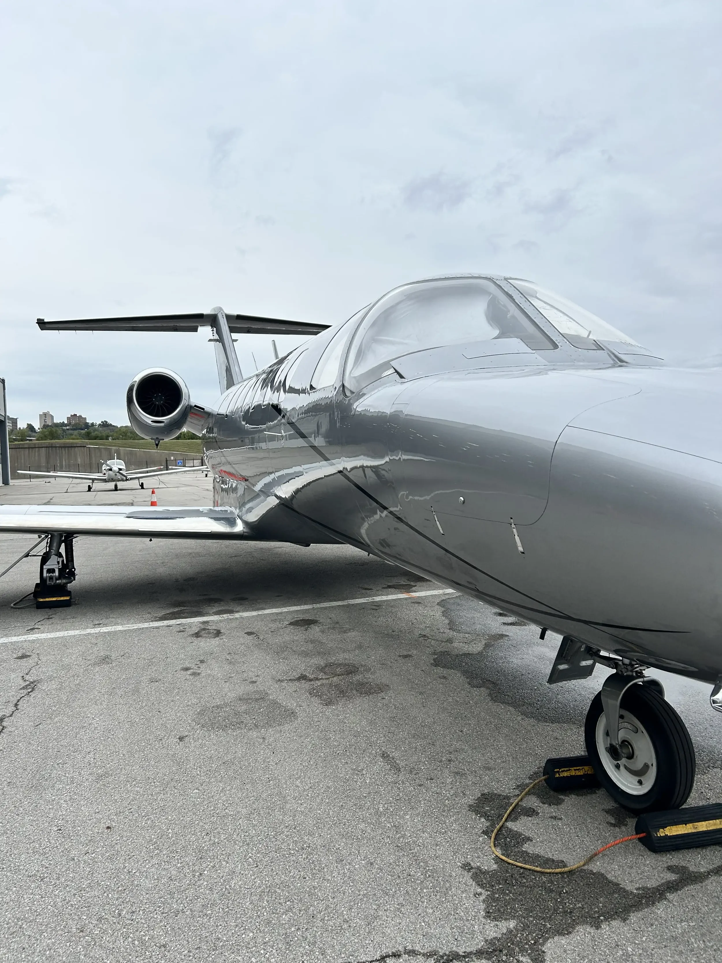 A grey and silver private jet that was washed and detailed by Pure Aviation Detailing in Kansas City Missouri at Charles B. Wheeler Downtown Airport KMKC MKC