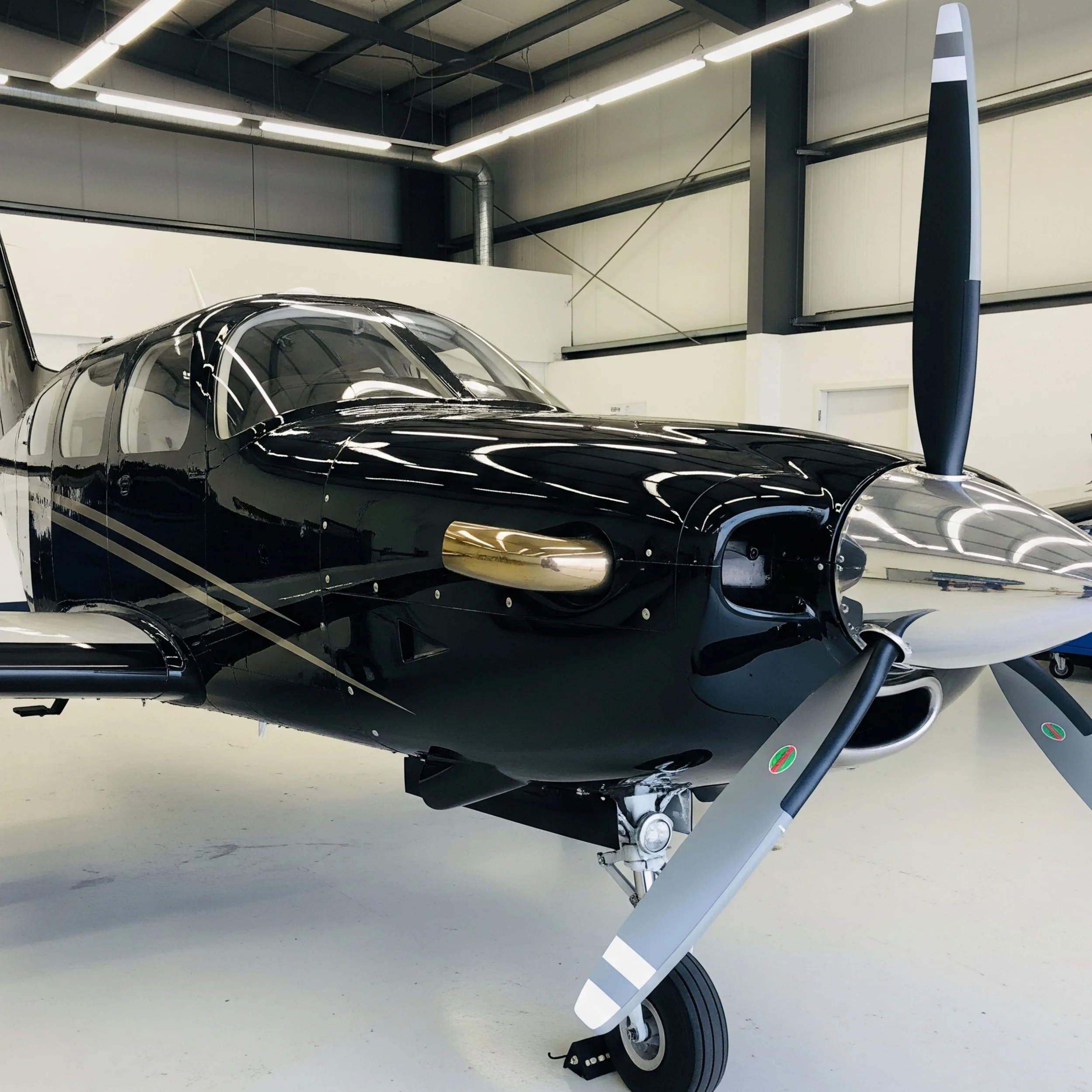 Small black turbo prop detailed by pure aviation detailing in Bentonville Arkansas at KVBT VBT