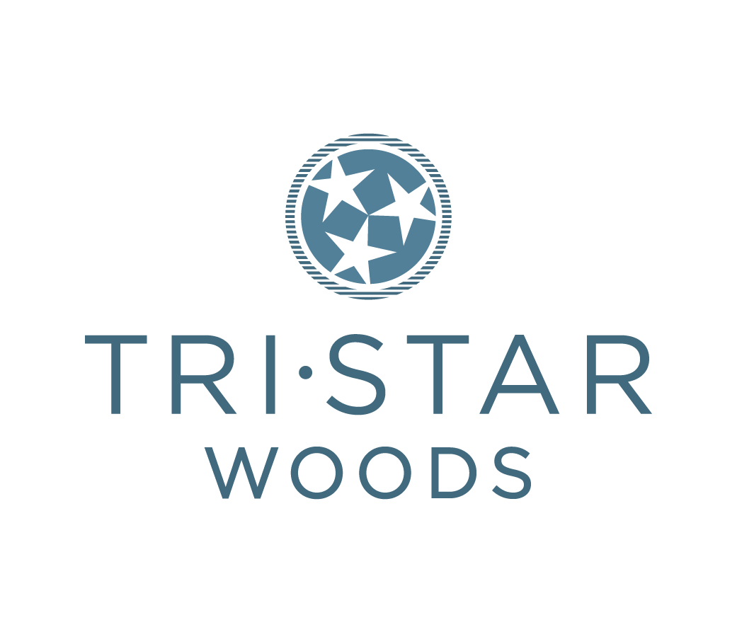 Logo for Tri - Star Woods featuring a circle with three stars inside and the text 'TRI·STAR WOODS' below.