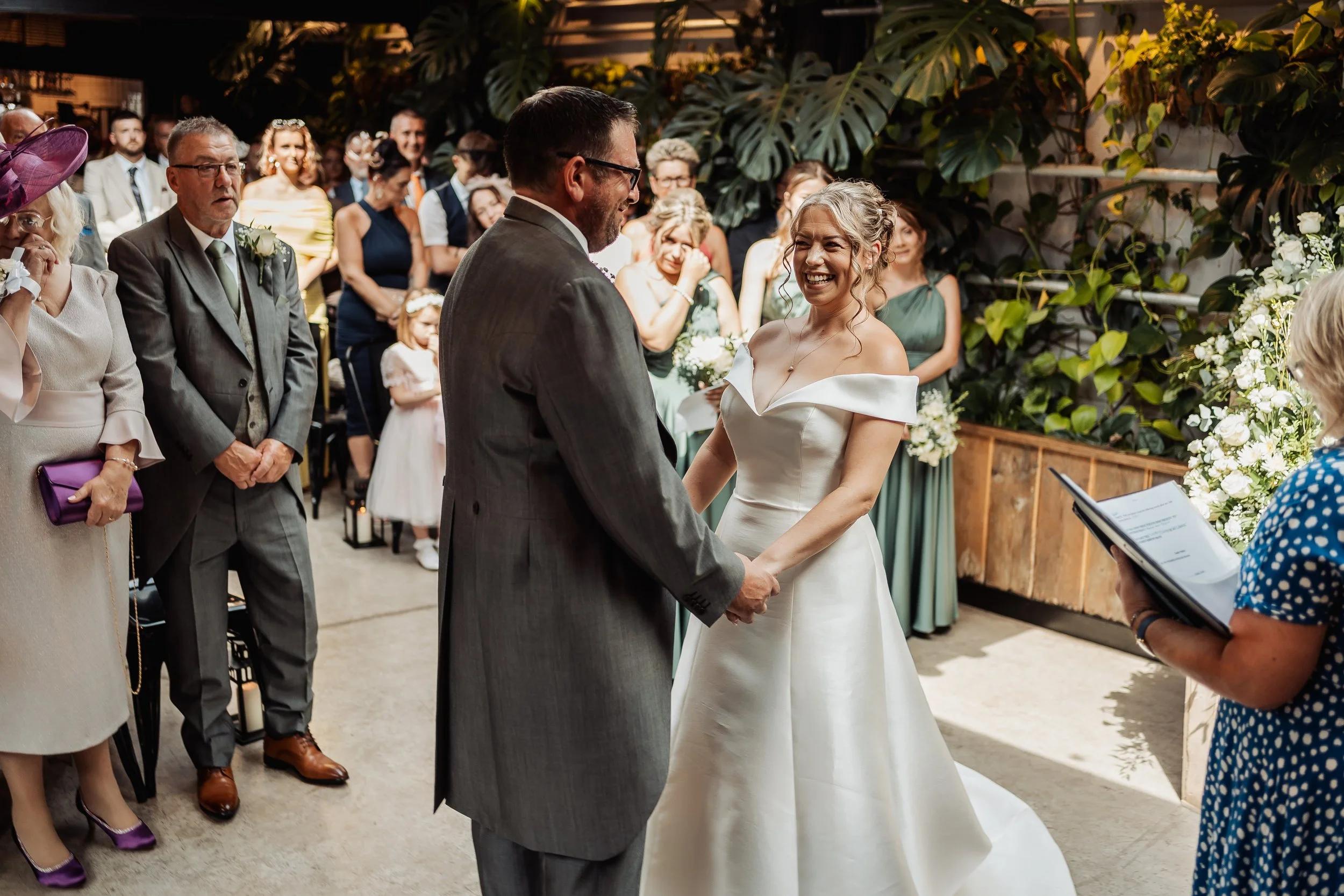 Couple getting married in shack revolution Hereford, mum & daughter crying on front row, bride smiling