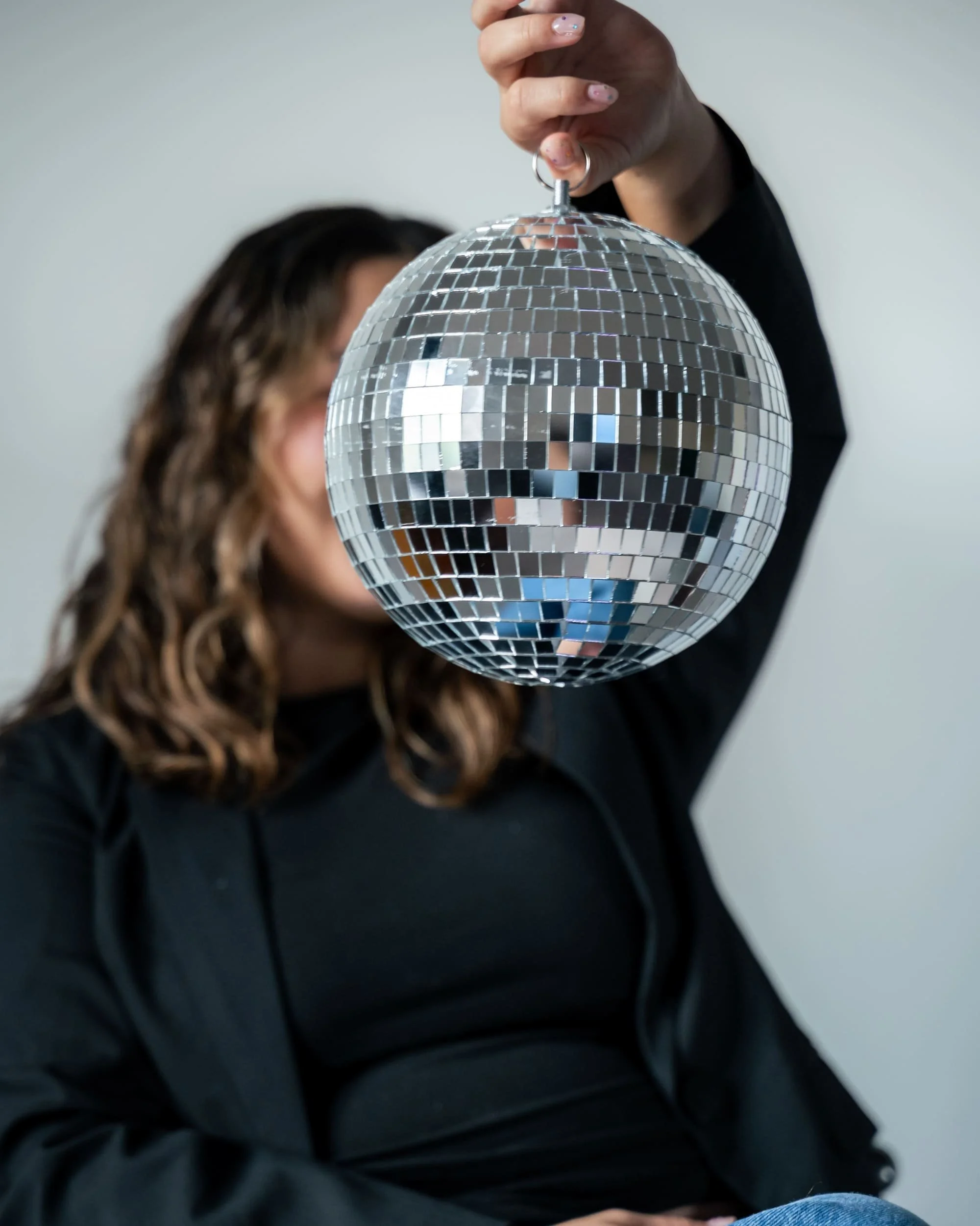 Content creator Pao Villas posing with her signature mirrorball
