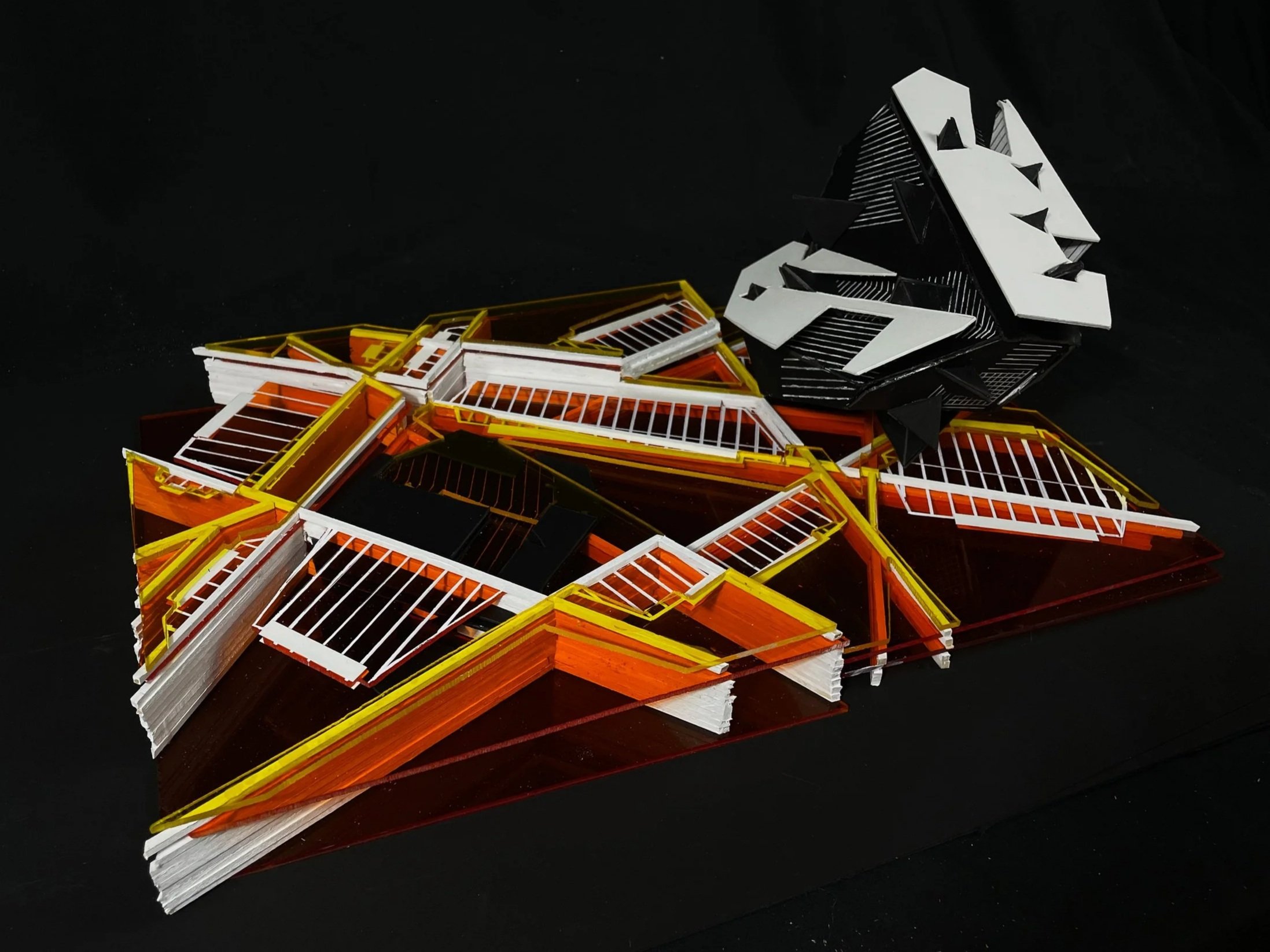 Image of an abstract yellow, orange, black and white model